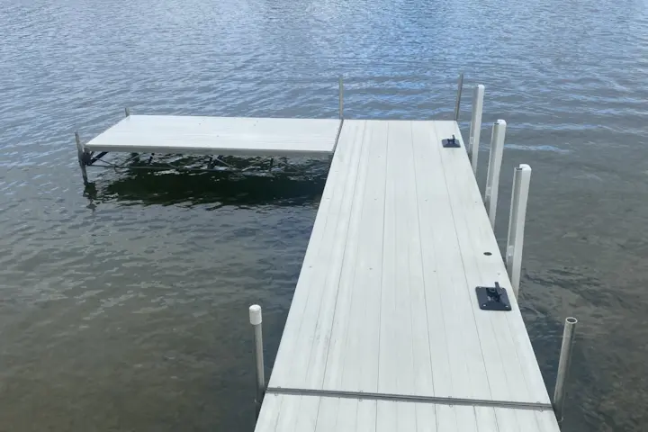 A freshly cleaned dock on a lake.